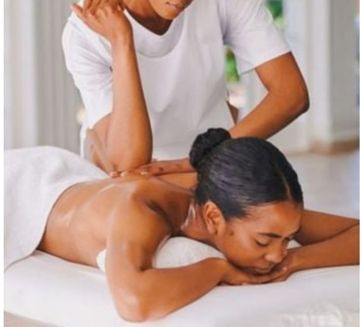 Therapist applying focused pressure during a back massage